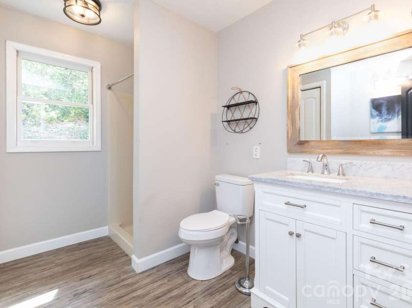 87 Medley Drive, Waynesville, NC 28785.  MLS# CAR4375332, YatesRealty ID 21884. Main Level Hall Bathroom