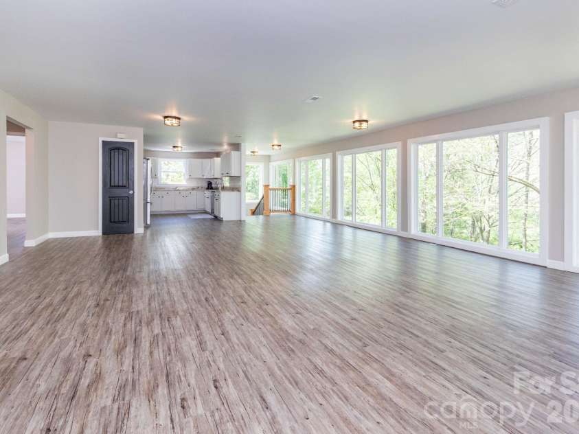 87 Medley Drive, Waynesville, NC 28785.  MLS# CAR4375332, YatesRealty ID 21884. Main Level Living/Dining Area