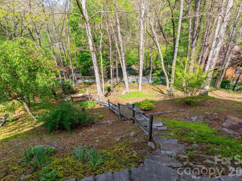 87 Medley Drive, Waynesville, NC 28785.  MLS# CAR4375332, YatesRealty ID 21884. Path to Creek