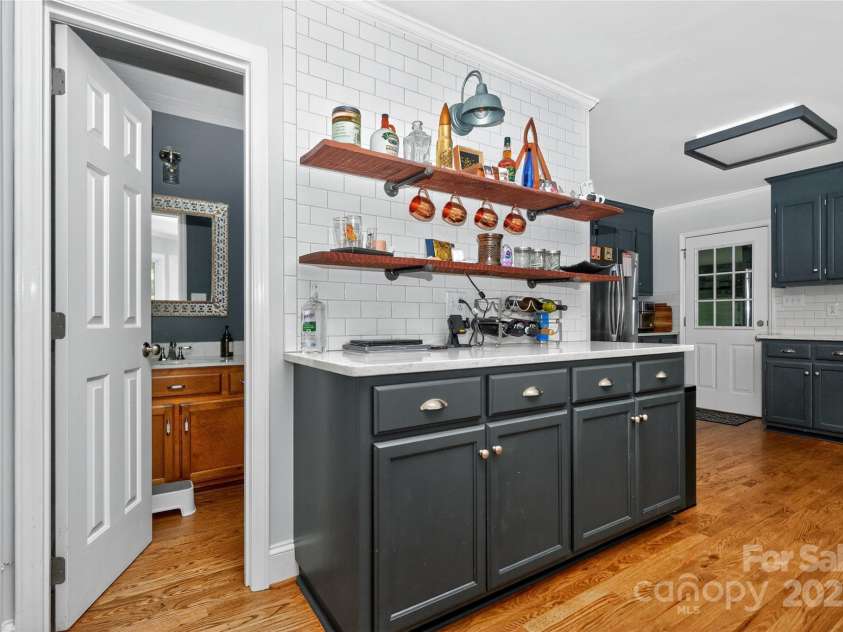 8300 Quarters Lane, Mint Hill, NC 28227.  MLS# CAR4271325, YatesRealty ID 21887. Powder room conveniently located off kitchen