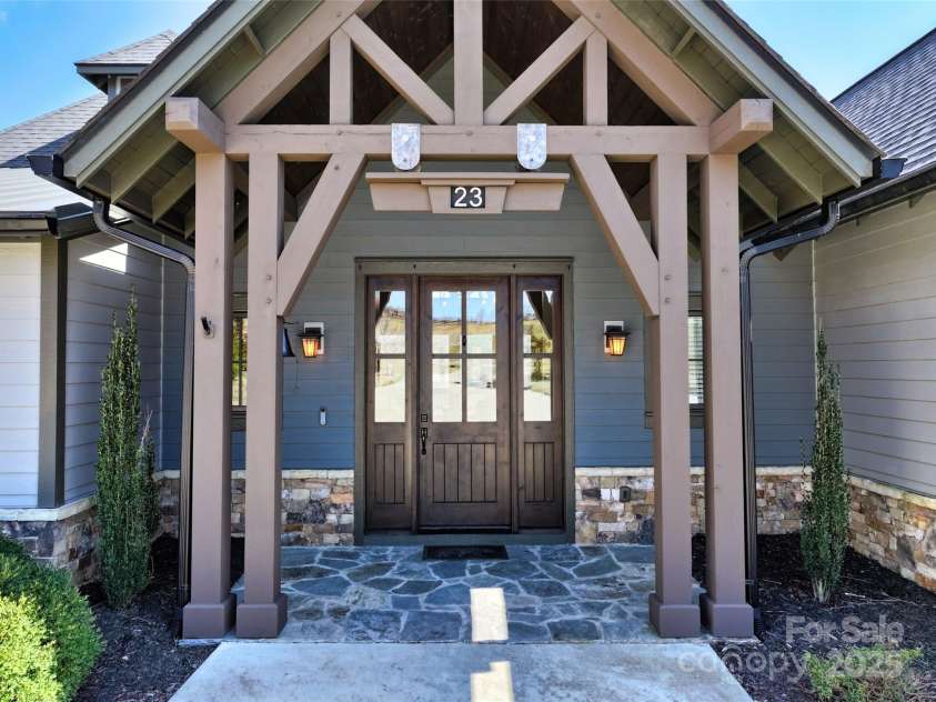 23 Thunder Mountain Road, Hendersonville, NC 28792.  MLS# CAR4213097, YatesRealty ID 21895. Gorgeous entrance with front door made from knotty Elder