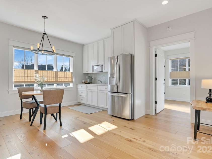 23 Thunder Mountain Road, Hendersonville, NC 28792.  MLS# CAR4213097, YatesRealty ID 21895. Guest wing with living room, stacked stone fireplace and kitchen