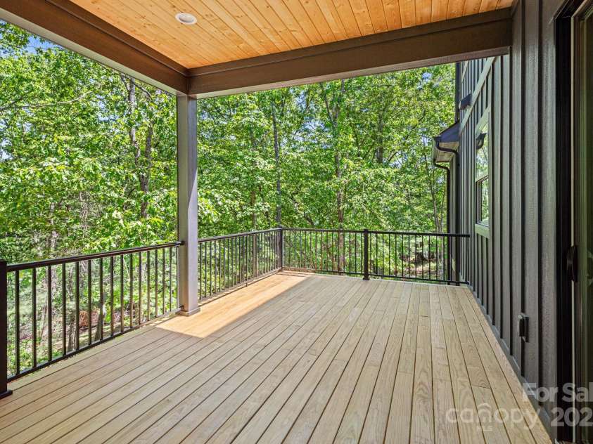 611 Crystal Heights Drive, Hendersonville, NC 28739.  MLS# CAR4263077, YatesRealty ID 21896. Back Covered Porch