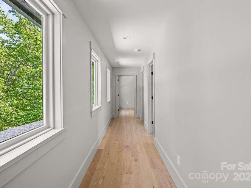 611 Crystal Heights Drive, Hendersonville, NC 28739.  MLS# CAR4263077, YatesRealty ID 21896. Hall on the upper floor