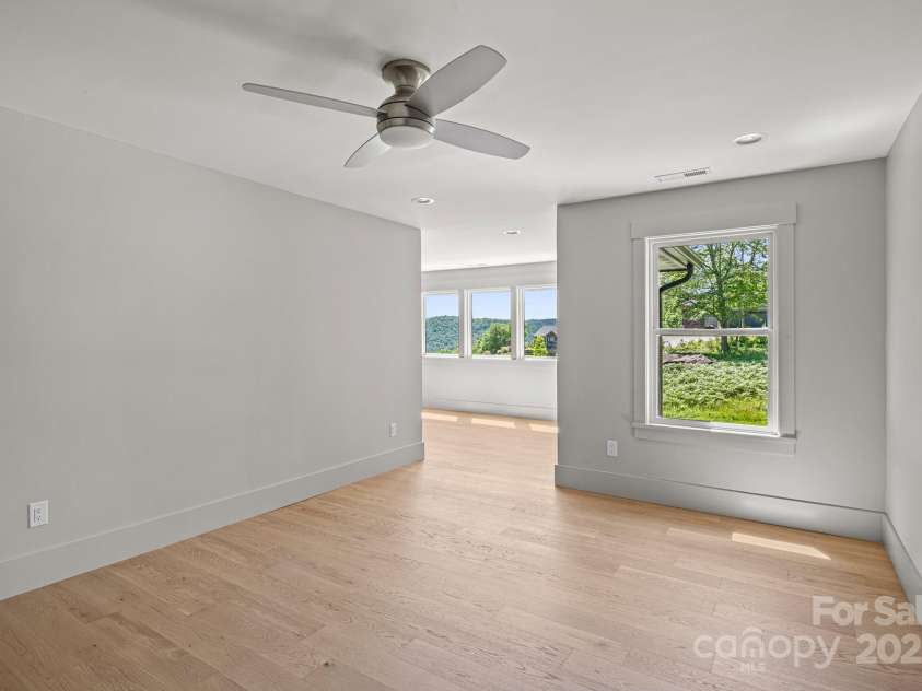 611 Crystal Heights Drive, Hendersonville, NC 28739.  MLS# CAR4263077, YatesRealty ID 21896. Spacious Bedroom upper Floor with a bonus area