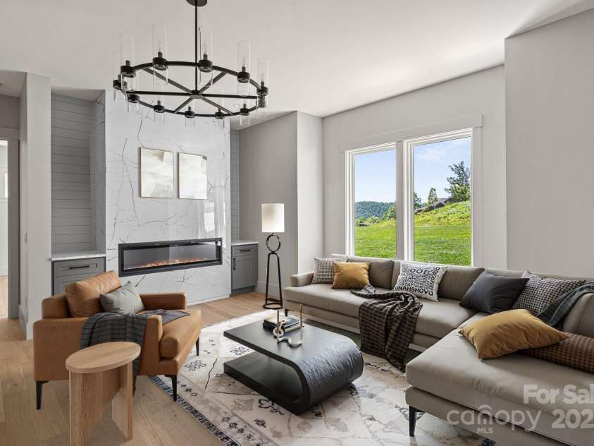 611 Crystal Heights Drive, Hendersonville, NC 28739.  MLS# CAR4263077, YatesRealty ID 21896. Staged Living Room