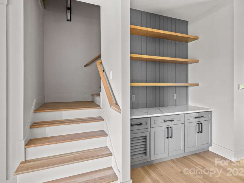 611 Crystal Heights Drive, Hendersonville, NC 28739.  MLS# CAR4263077, YatesRealty ID 21896. Wet bar and Stairway to upper floor