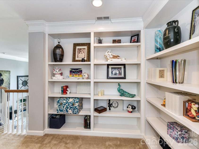 27246 Preston Place, Fort Mill, SC 29707.  MLS# CAR4372170, YatesRealty ID 21901. Second level custom bookcase