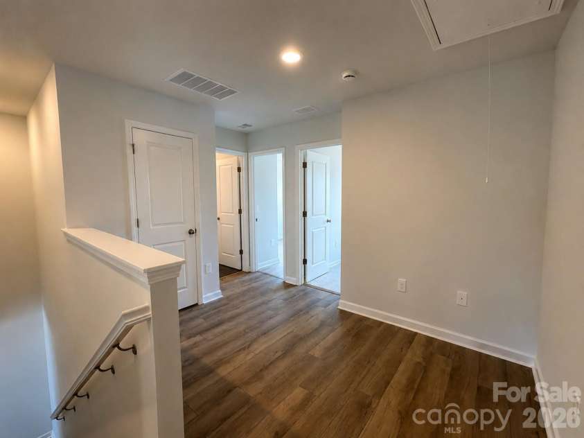 577 Cape Cod Way, Rock Hill, SC 29732.  MLS# CAR4354156, YatesRealty ID 21906. LVP Steps lead to an open loft