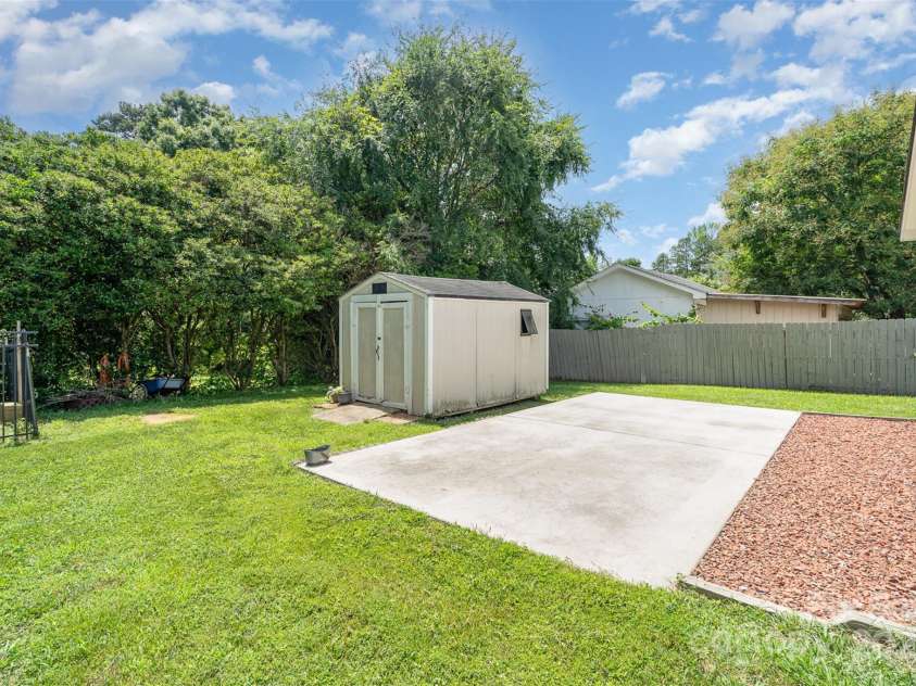 5701 Cedar Hill Drive, Monroe, NC 28110.  MLS# CAR4271384, YatesRealty ID 21913. Additional storage shed with concrete pad for boat