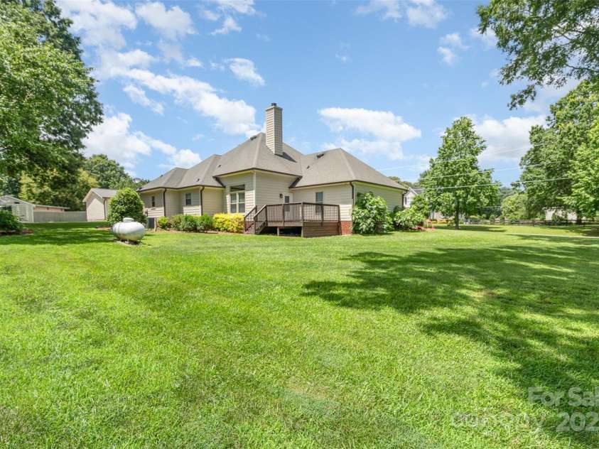 5701 Cedar Hill Drive, Monroe, NC 28110.  MLS# CAR4271384, YatesRealty ID 21913. Rear of home from back of property