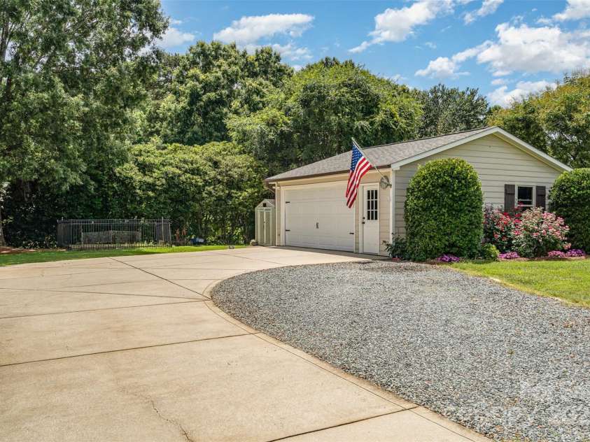 5701 Cedar Hill Drive, Monroe, NC 28110.  MLS# CAR4271384, YatesRealty ID 21913. Two-car detached garage w/storage