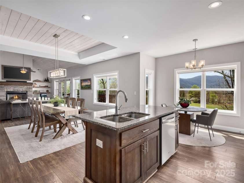 116 Whispering Wind Drive, Black Mountain, NC 28711.  MLS# CAR4245710, YatesRealty ID 21914. Kitchen Island and Kitchen Table