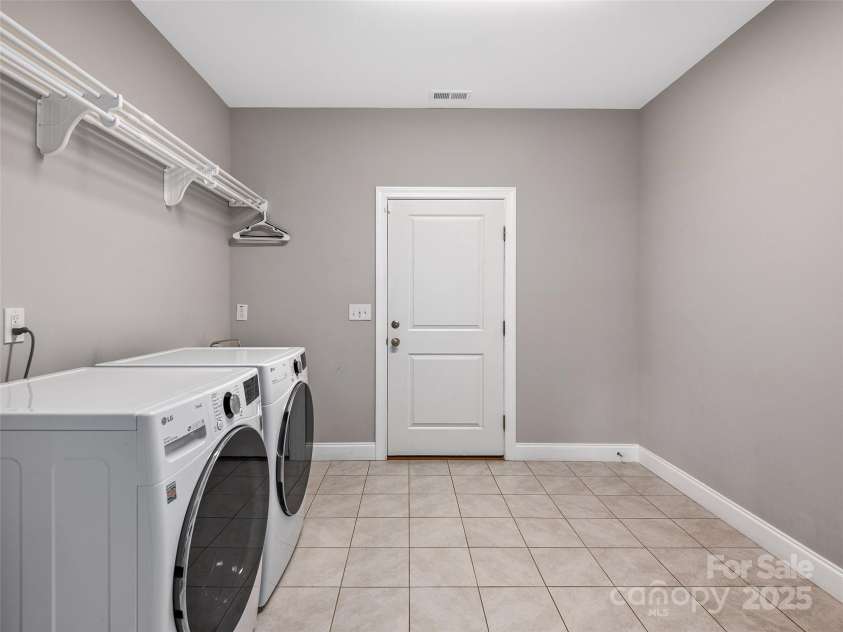 116 Whispering Wind Drive, Black Mountain, NC 28711.  MLS# CAR4245710, YatesRealty ID 21914. Laundry Room and Garage Access - Large Walk In Closet