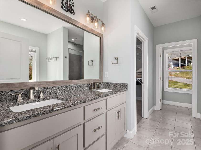 116 Whispering Wind Drive, Black Mountain, NC 28711.  MLS# CAR4245710, YatesRealty ID 21914. Primary Bathroom With Soaking Tub & Shower