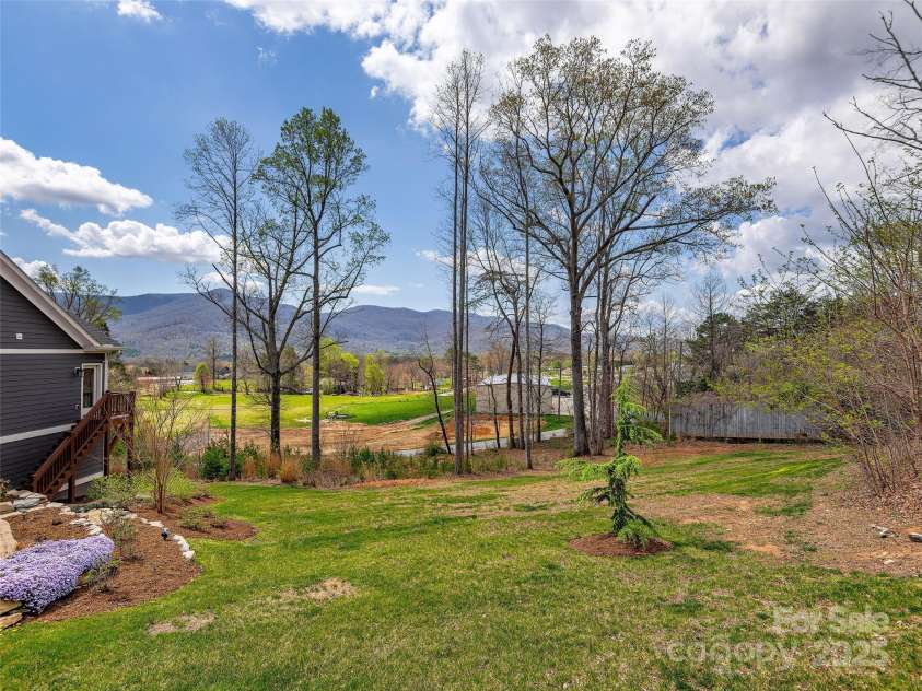 116 Whispering Wind Drive, Black Mountain, NC 28711.  MLS# CAR4245710, YatesRealty ID 21914. Side Yard