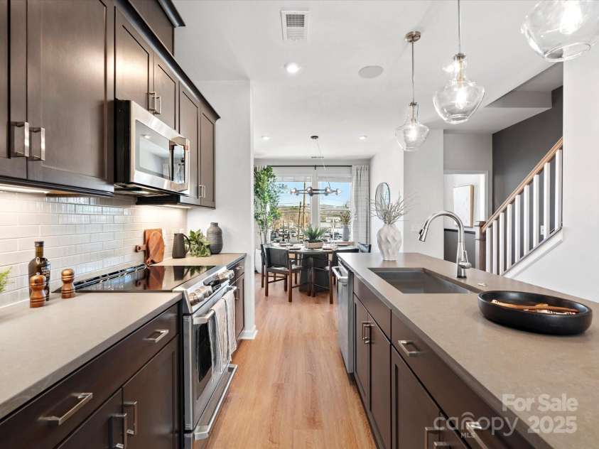 5608 Kingspan Drive, Charlotte, NC 28217.  MLS# CAR4211279, YatesRealty ID 21915. Merrill Model Kitchen | Southmont *actual finishes, color scheme, orientation vary on this home. Furniture not included