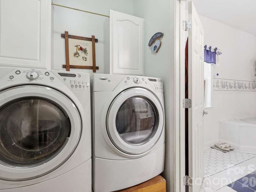 2225 Bald Creek Road, Clyde, NC 28721.  MLS# CAR4375884, YatesRealty ID 21920. Laundry room on the second floor