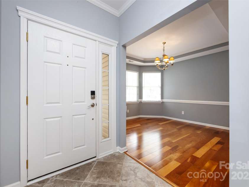 1040 Stonedown Lane, Matthews, NC 28104.  MLS# CAR4271671, YatesRealty ID 21926. Foyer with view of Dining Room