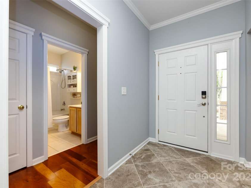 1040 Stonedown Lane, Matthews, NC 28104.  MLS# CAR4271671, YatesRealty ID 21926. Foyer with view of guest rooms