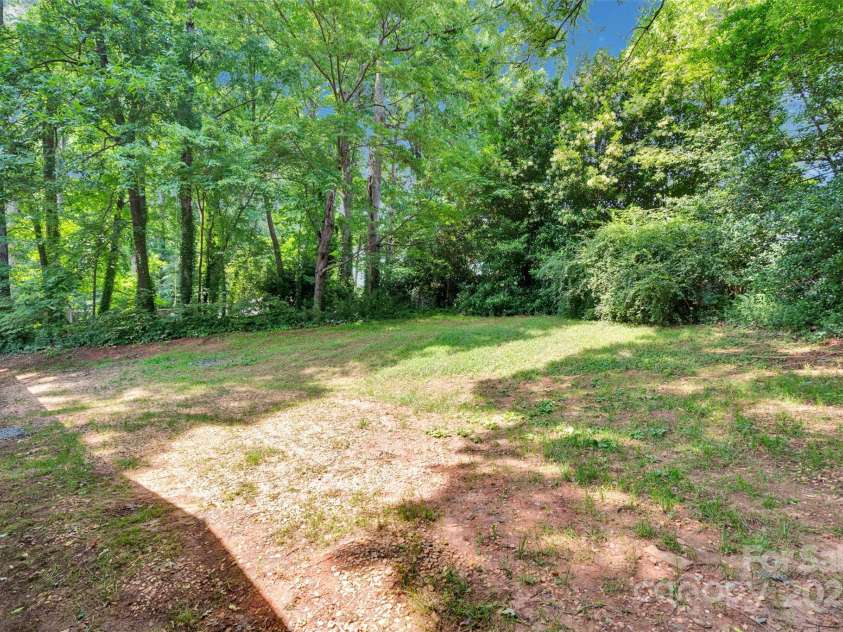 331 Glen Oaks Road, Charlotte, NC 28270.  MLS# CAR4260350, YatesRealty ID 21929. Backyard lined with mature shade trees