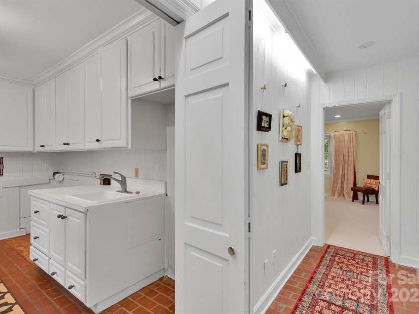 331 Glen Oaks Road, Charlotte, NC 28270.  MLS# CAR4260350, YatesRealty ID 21929. Left wing - laundry room and hallway to Primary Bedroom