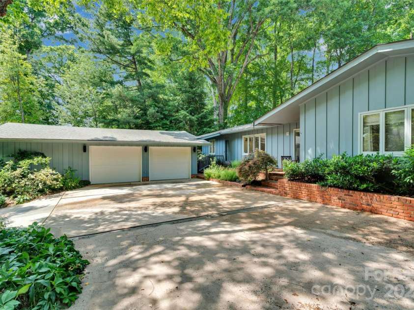 331 Glen Oaks Road, Charlotte, NC 28270.  MLS# CAR4260350, YatesRealty ID 21929. Plenty of parking in either garage or additional space for 2 vehicles shielded by greenery