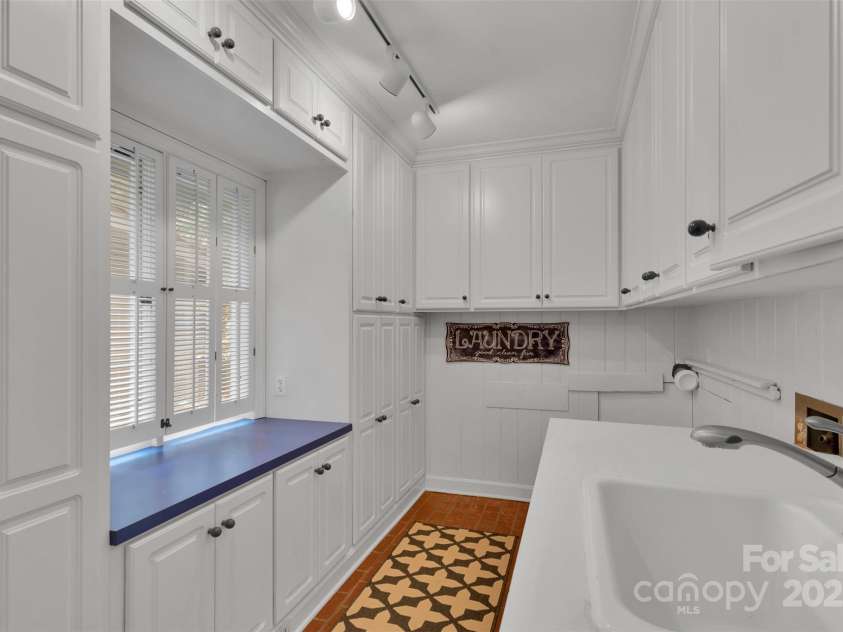 331 Glen Oaks Road, Charlotte, NC 28270.  MLS# CAR4260350, YatesRealty ID 21929. Really?? This laundry room is every woman's dream! Closet-style cabinetry + room for an add'l fridge