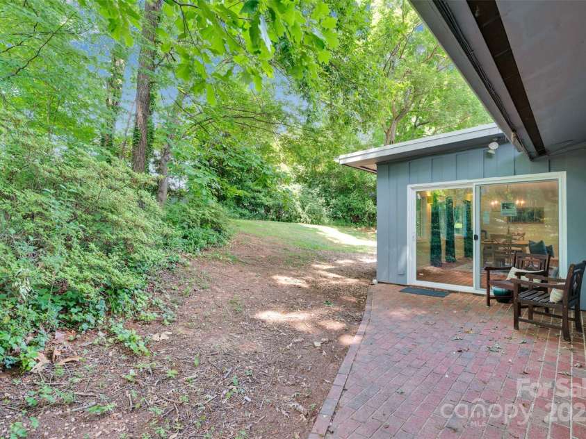331 Glen Oaks Road, Charlotte, NC 28270.  MLS# CAR4260350, YatesRealty ID 21929. Rear patio that provides shade and access to the large dining/sunroom area through the brand new sliding door
