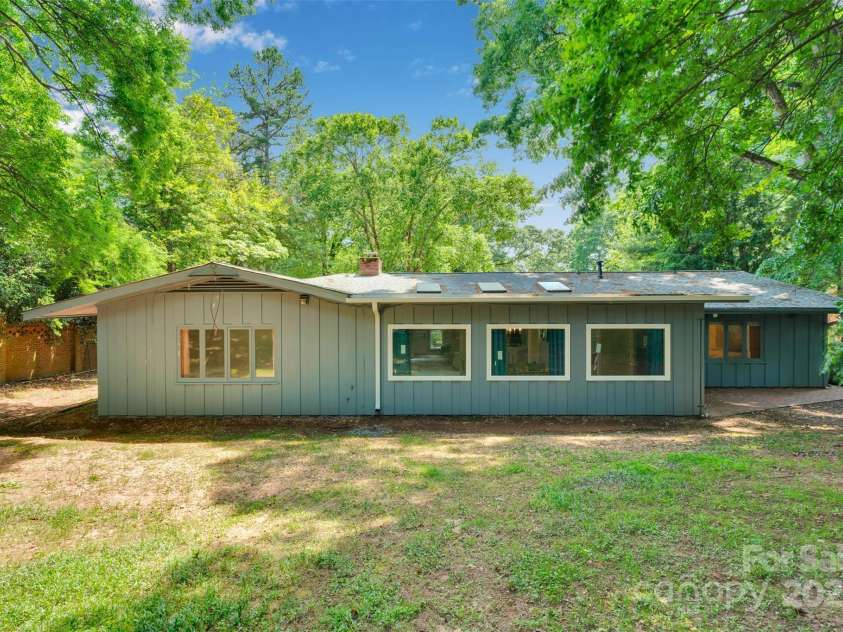 331 Glen Oaks Road, Charlotte, NC 28270.  MLS# CAR4260350, YatesRealty ID 21929. Rear view of home. Partially fenced w/ a slight slope