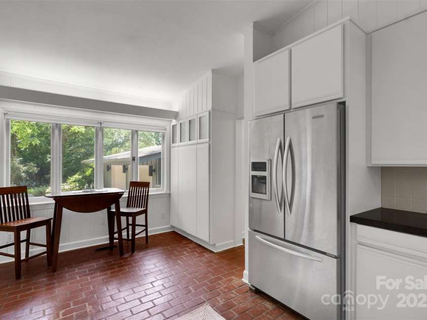 331 Glen Oaks Road, Charlotte, NC 28270.  MLS# CAR4260350, YatesRealty ID 21929. Sleek pantry w/ deep shelving makes storing dry goods a breeze