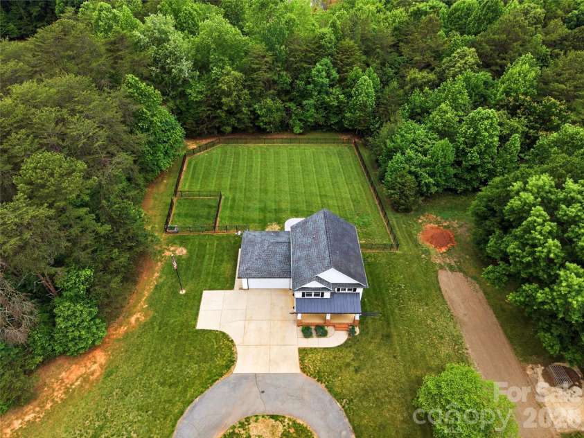 4945 Grassy Creek Road, Denver, NC 28037.  MLS# CAR4380541, YatesRealty ID 21933. Aerial View of fenced back yard