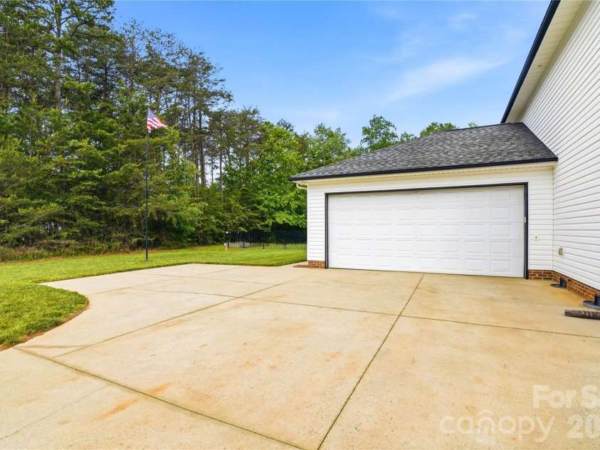 4945 Grassy Creek Road, Denver, NC 28037.  MLS# CAR4380541, YatesRealty ID 21933. Garage and Parking area