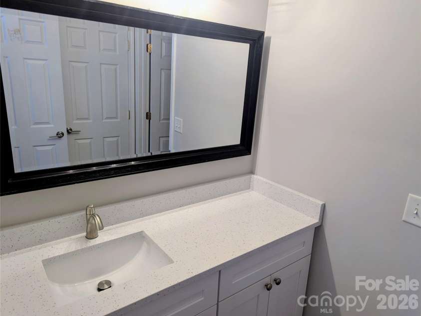 10932 Stone Trail Road, Charlotte, NC 28213.  MLS# CAR4371875, YatesRealty ID 21935. 2nd level bath vanity w Quartz ctops