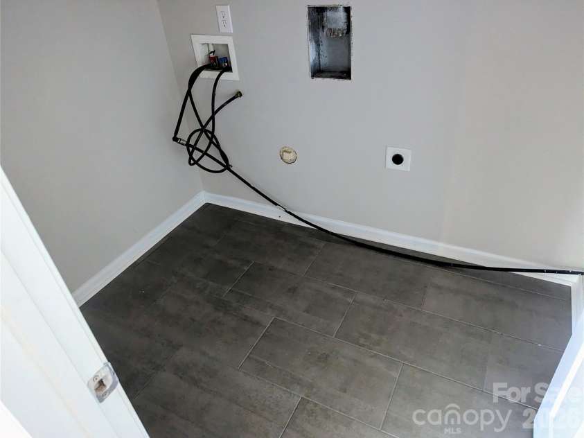 10932 Stone Trail Road, Charlotte, NC 28213.  MLS# CAR4371875, YatesRealty ID 21935. Laundry room has tiled floor