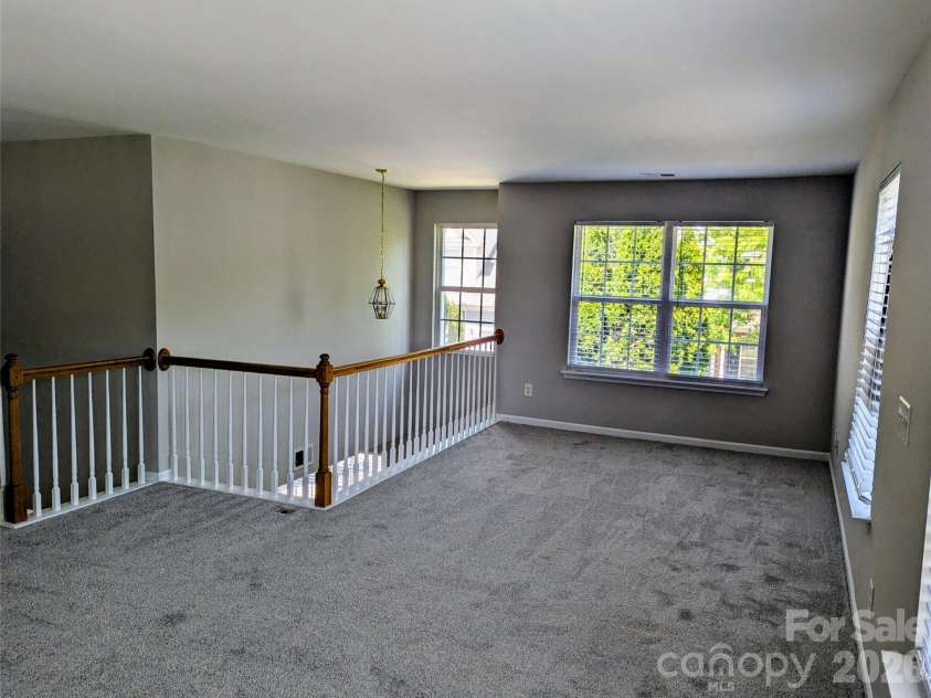 10932 Stone Trail Road, Charlotte, NC 28213.  MLS# CAR4371875, YatesRealty ID 21935. Loft with spindled rail