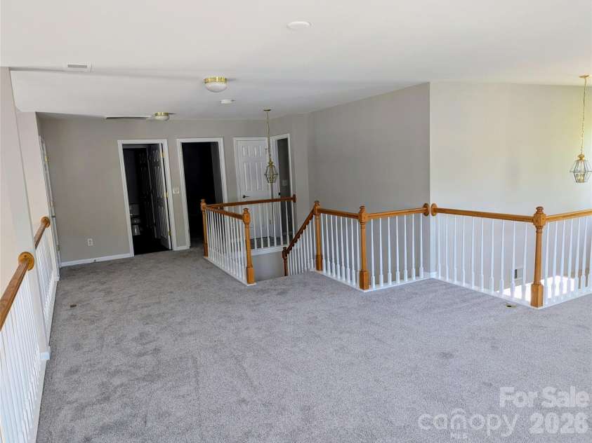 10932 Stone Trail Road, Charlotte, NC 28213.  MLS# CAR4371875, YatesRealty ID 21935. Loft with spindled rail