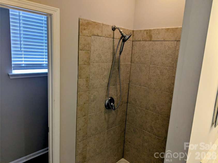 10932 Stone Trail Road, Charlotte, NC 28213.  MLS# CAR4371875, YatesRealty ID 21935. Primary bath Tiled shower