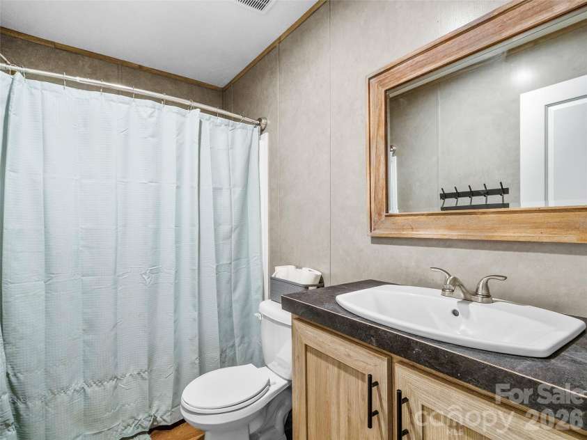 293 Spar Mill Road, Burnsville, NC 28714.  MLS# CAR4377437, YatesRealty ID 21943. Guest Bathroom