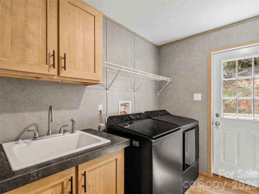 293 Spar Mill Road, Burnsville, NC 28714.  MLS# CAR4377437, YatesRealty ID 21943. Laundry Room
