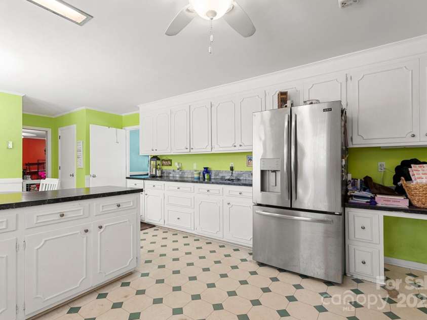 1210 Brookwood Drive, Shelby, NC 28150.  MLS# CAR4229216, YatesRealty ID 21944. ...and refrigerator. There is also a built-in desk area in the kitchen.