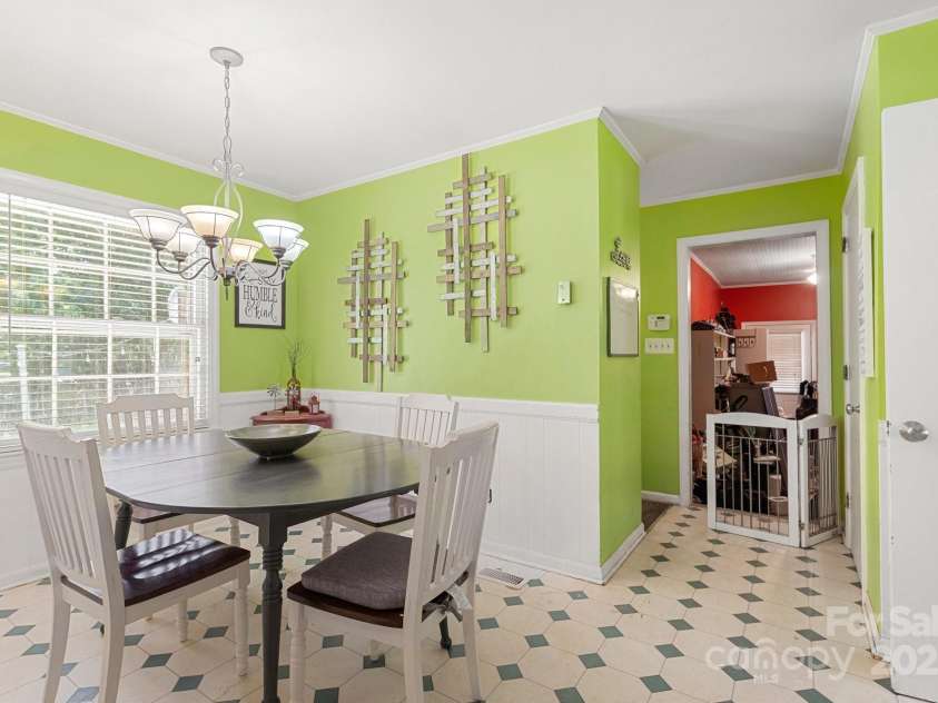 1210 Brookwood Drive, Shelby, NC 28150.  MLS# CAR4229216, YatesRealty ID 21944. Off the breakfast area is a hallway that leads to the laundry room and a large bonus room that was converted from the two car garage.