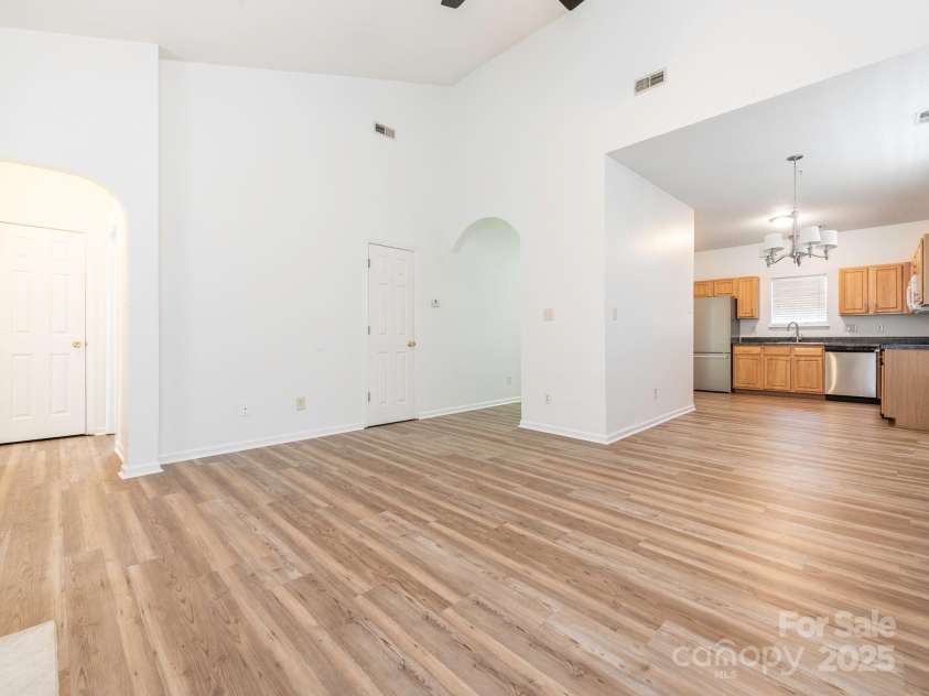 6212 Derryfield Drive, Charlotte, NC 28213.  MLS# CAR4252797, YatesRealty ID 21950. Living Room into dining area & kitchen