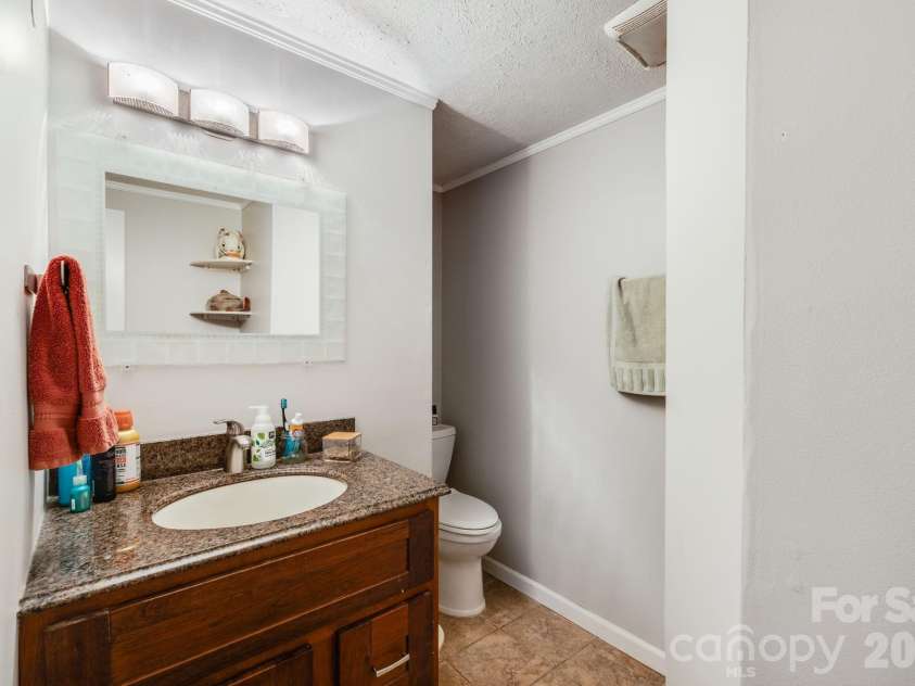 107 Courtland Avenue, Asheville, NC 28801.  MLS# CAR4376607, YatesRealty ID 21952. Lower unit bathroom