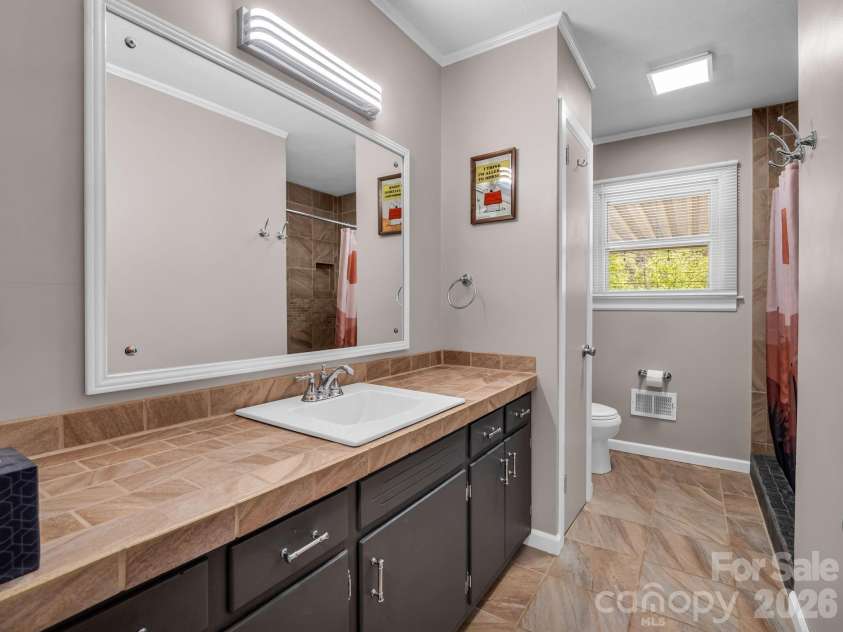 2521 Cat Square Road, Vale, NC 28168.  MLS# CAR4367429, YatesRealty ID 21955. Full bath with walk in tile shower