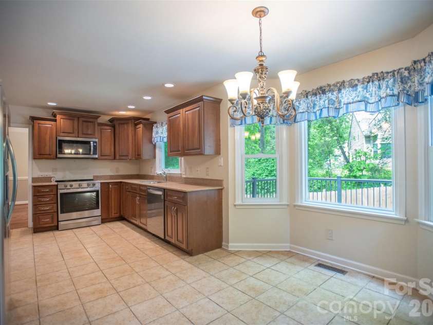 1002 Windsor Drive, Asheville, NC 28803.  MLS# CAR4361534, YatesRealty ID 21960. Kitchen with beautiful windows