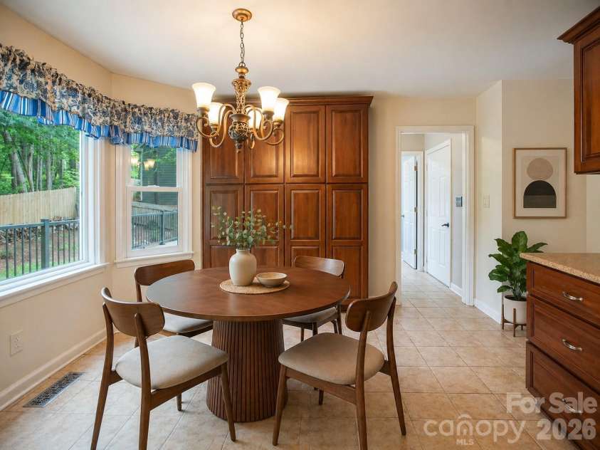 1002 Windsor Drive, Asheville, NC 28803.  MLS# CAR4361534, YatesRealty ID 21960. Virtually staged kitchen dining area