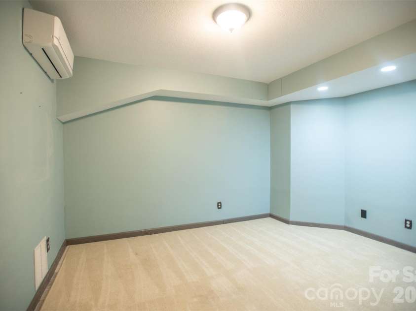 1002 Windsor Drive, Asheville, NC 28803.  MLS# CAR4413516, YatesRealty ID 21960. Bonus room lower level