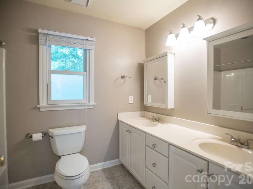 1002 Windsor Drive, Asheville, NC 28803.  MLS# CAR4413516, YatesRealty ID 21960. Full 2nd bath upper level