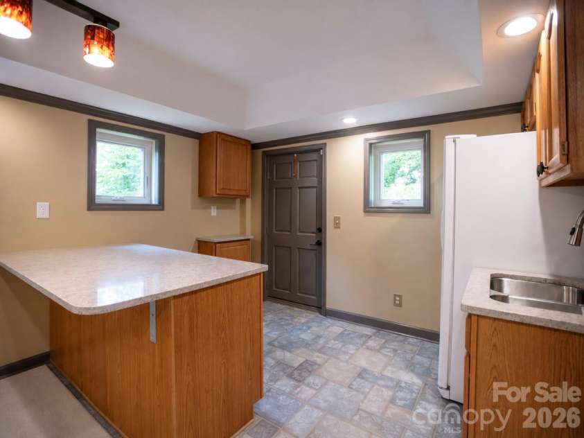 1002 Windsor Drive, Asheville, NC 28803.  MLS# CAR4413516, YatesRealty ID 21960. Lower level